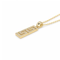 Georgios Collections: ciondolo con motivo a greca in oro giallo 18 carati con piccoli diamanti
