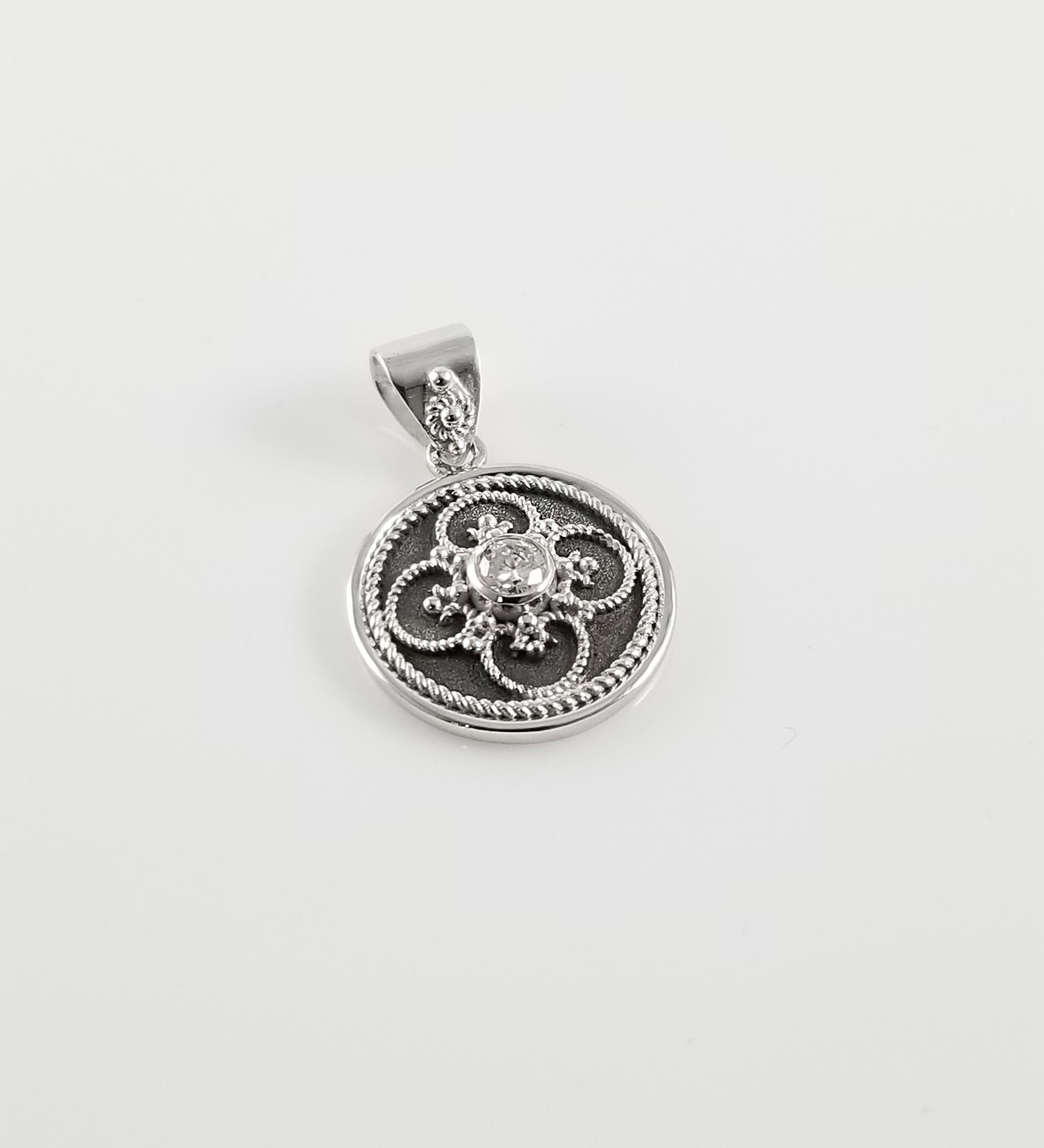S.Georgios designer Pendant is all handmade from solid 18 Karat White Gold. This elegant pendant is microscopically decorated - it has granulation work all the way around with white gold beads and wires shaped like the last letter of the Greek