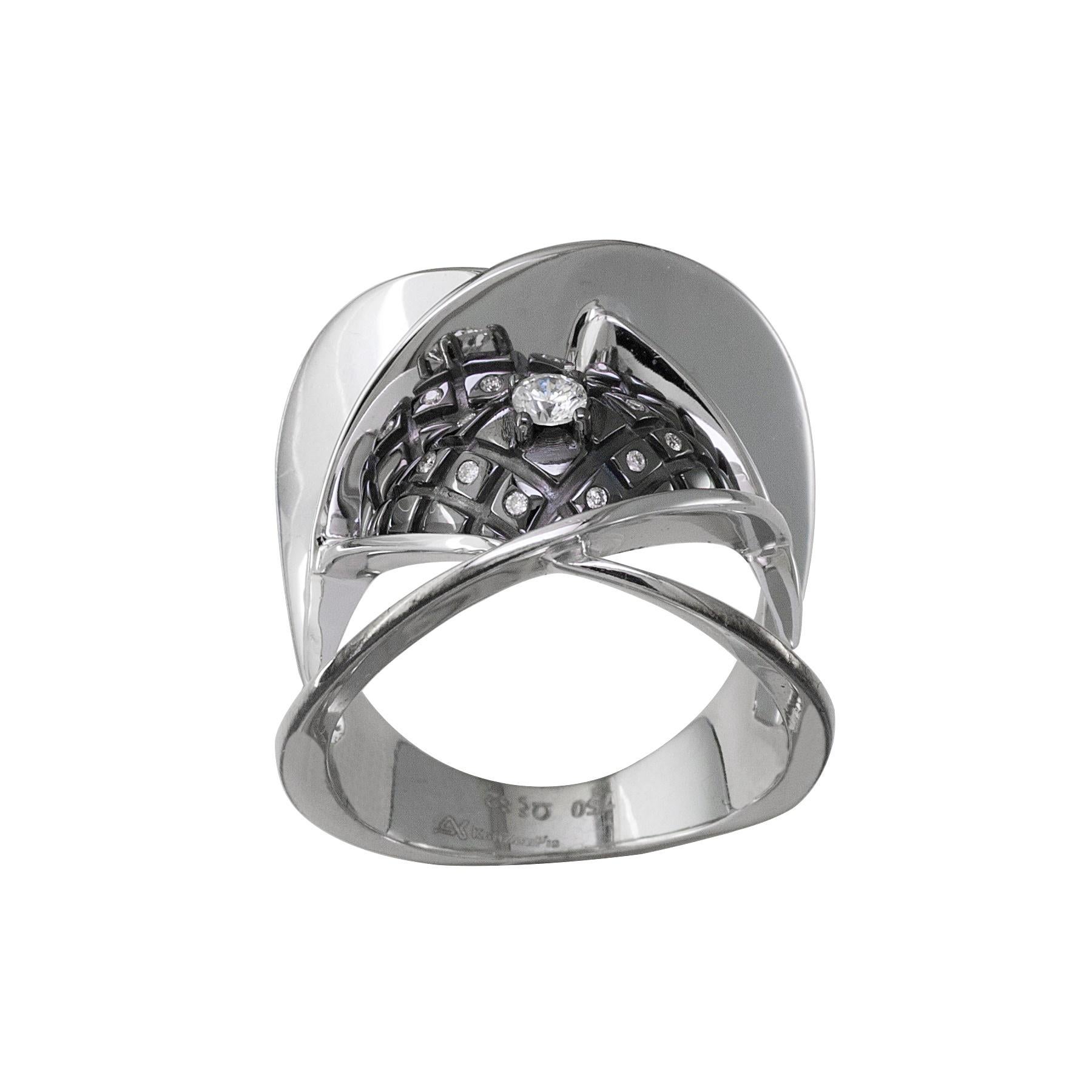 S. Georgios 18 Karat White Gold Diamond Ring which is Designed with Architectural precision. 
The stunning ring is unique as a design and features White Brilliant cut Diamonds total weight of 0,15 Carat and Black Rhodium prongs and background done