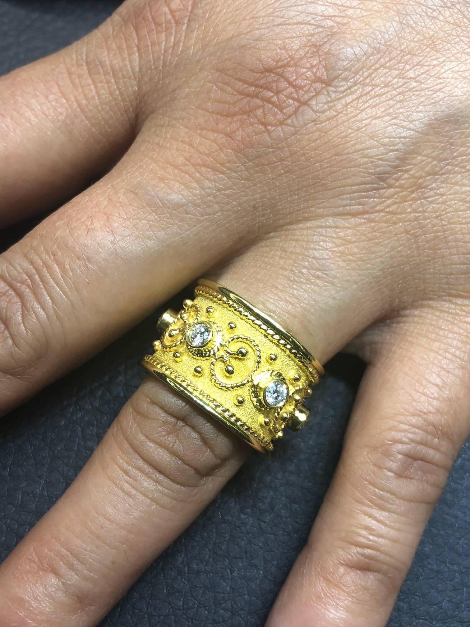 S.Georgios design ring is handmade from solid 18 Karat Yellow Gold and is microscopically decorated all the way around with gold beads and wires shaped like the last letter of Greek Alphabet - Omega, which symbolizes eternal life. Granulated details