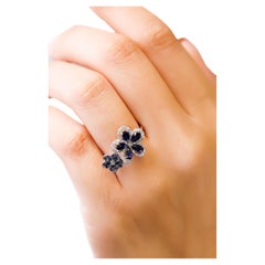14 Karat White Gold Blue Sapphire 0.29 Carat Diamond Double Flower Bridal Ring