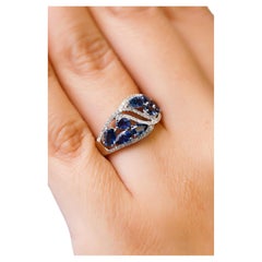 14 Karat White Gold 2.24 Carat Oval Blue Sapphire 0.22 Carat Diamond Band Ring