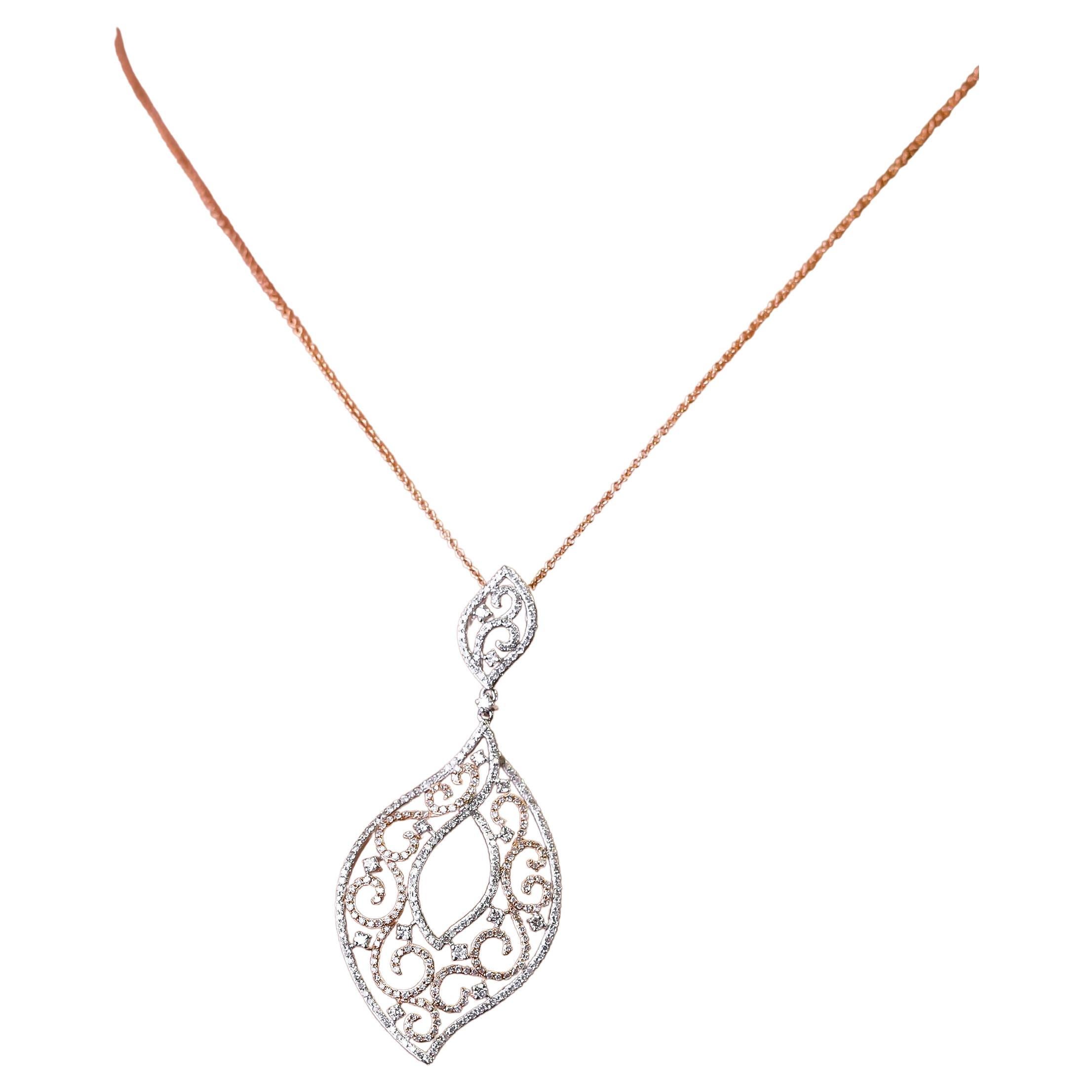 1.29 Carat Diamond 14 Karat Two-Tone Gold Filigree Pendant Fine Jewelry Collection
 
Dramatic design. Created in 14k rose and white gold this dramatic pendant necklace features 1.29 TCW or round shimmering diamonds delicately layered in an ornament