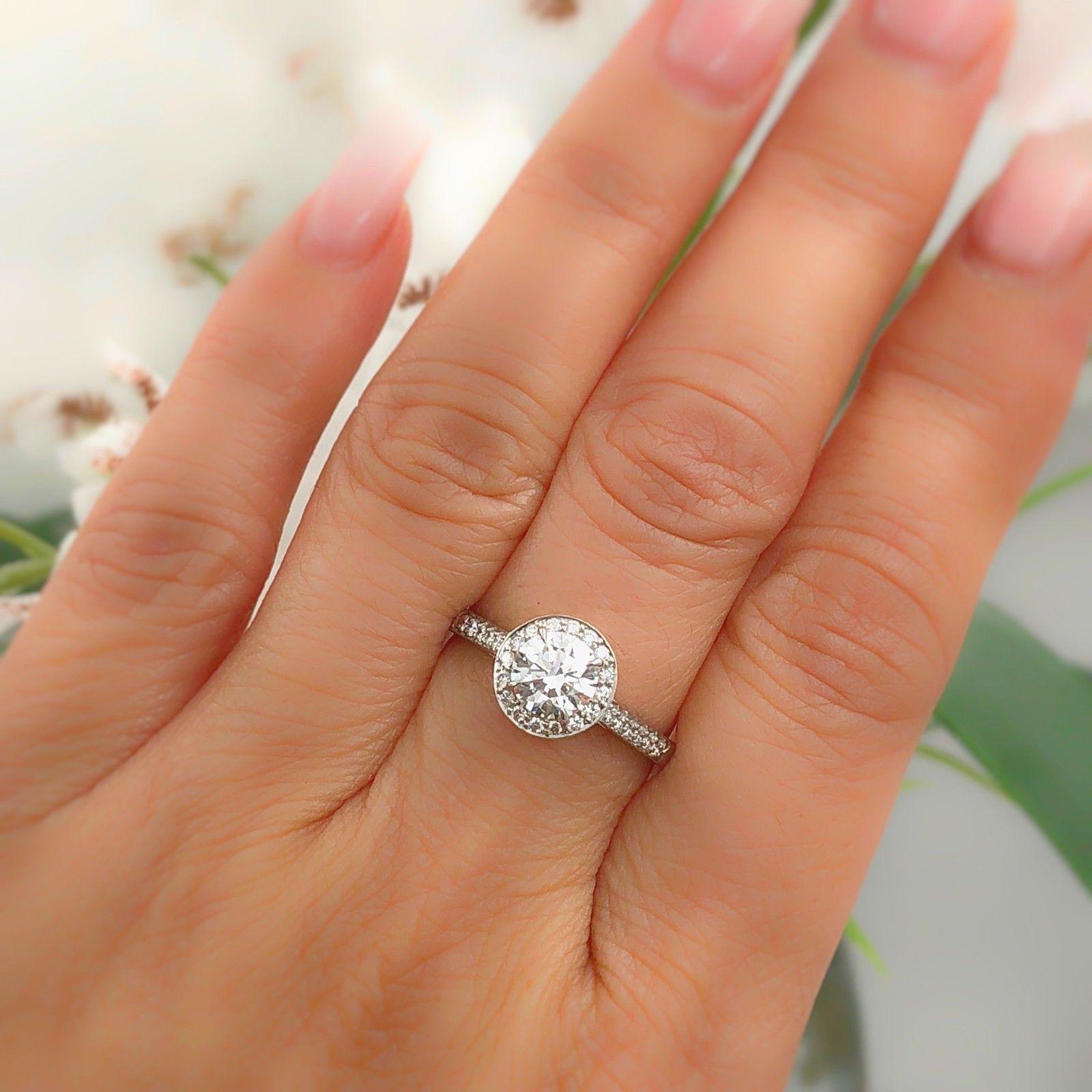 Tiffany & Co.
Style:  Embrace Diamond Engagement Ring
Serial Number:  27090443 / L07270282
Metal:  Platinum PT950
Size:  6.25 - sizable
Total Carat Weight:  1.10 tcw
Diamond Shape:  Round Brilliant 0.88 cts
Diamond Color & Clarity:  E color, IF