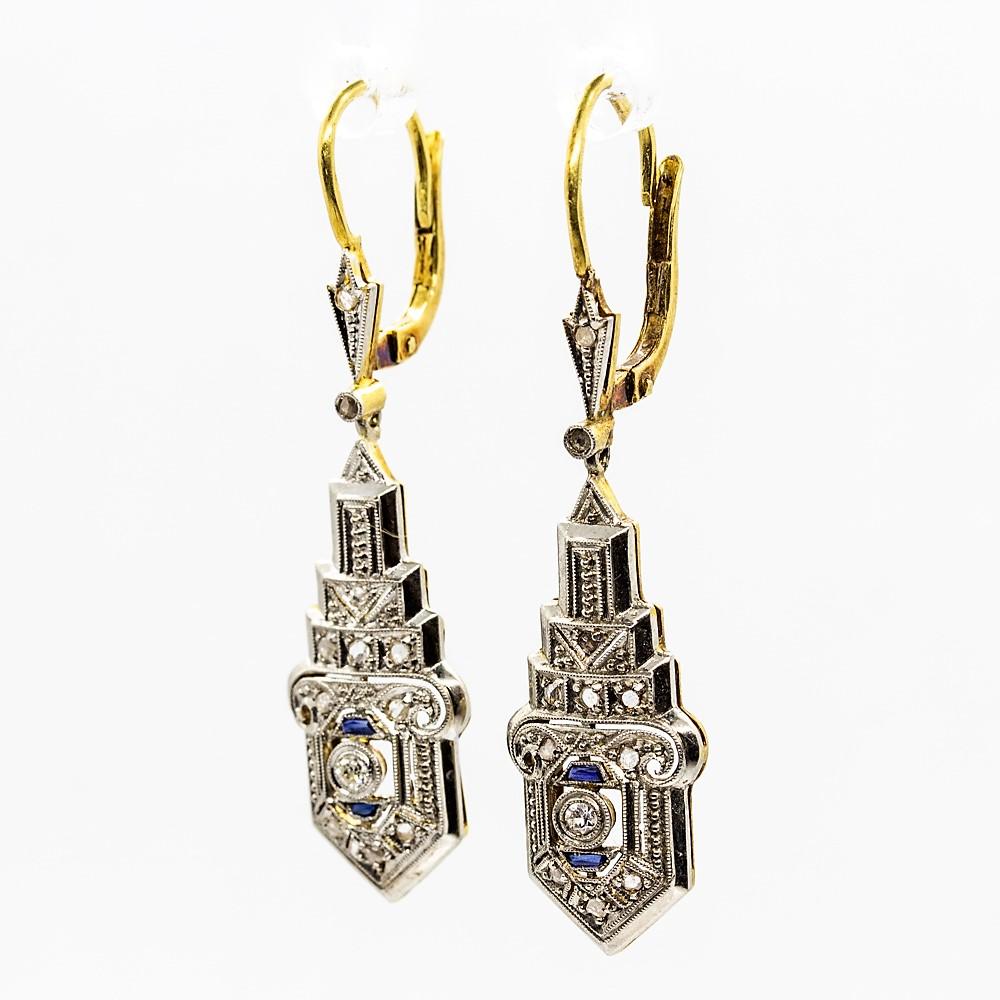 Period: Art Deco (1920-1935)
Composition: 18k Gold & Platinum
Stones:
•	22 Rose cut diamonds H-VS2 0.30ctw.
•	2 Single cut diamonds H-VS2 0.08ctw.
•	4 Natural calibrated cut sapphires 0.10ctw.
Earring measure: 42mm by 11mm
Thickness: 5mm
Total