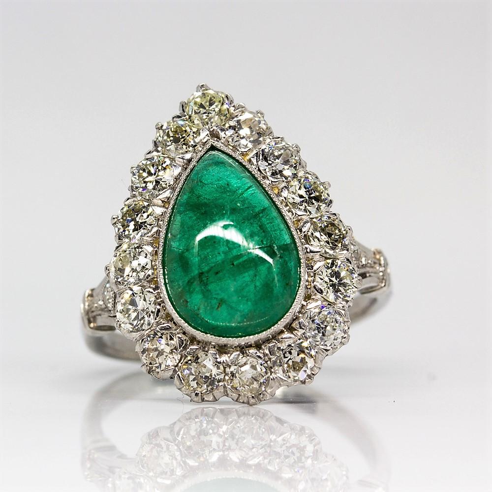 Composition: Platinum
Stones:
•	1 Natural pear shape emerald 3.10ctw.
•	18 Old mine cut diamonds H-VS2 1.38ctw
Ring size: 7
Ring face:  20mm by 15mm.
Rise above finger: 7mm.
Total weight:  6.8 grams – 4.4dwt.
Appraisal available under request.
SO