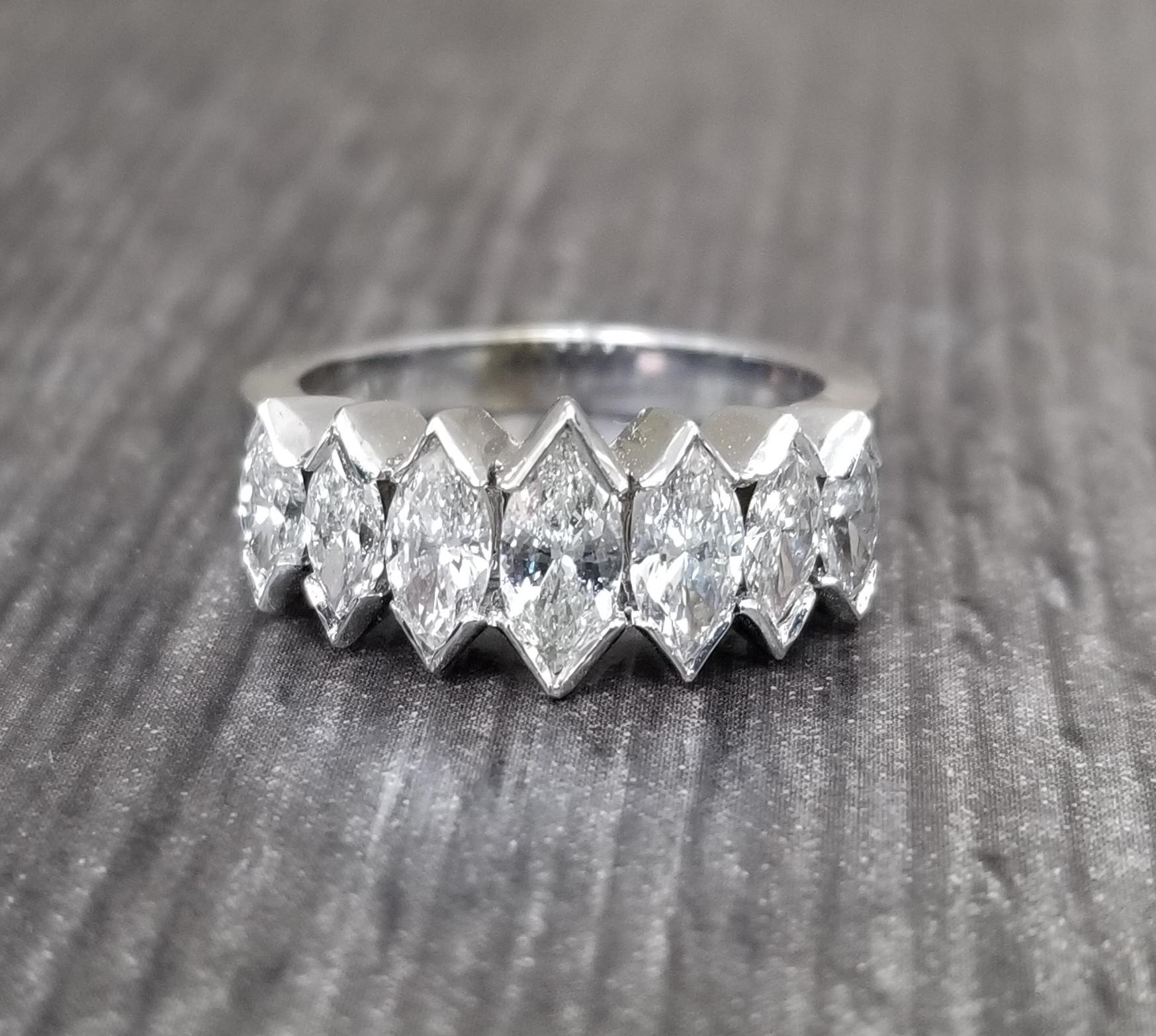 14k white gold ladies diamond wedding ring, containing 7 marquise cut diamonds of very fine quality weighing 1.55cts. ring size 6.5, ring can be sized to fit