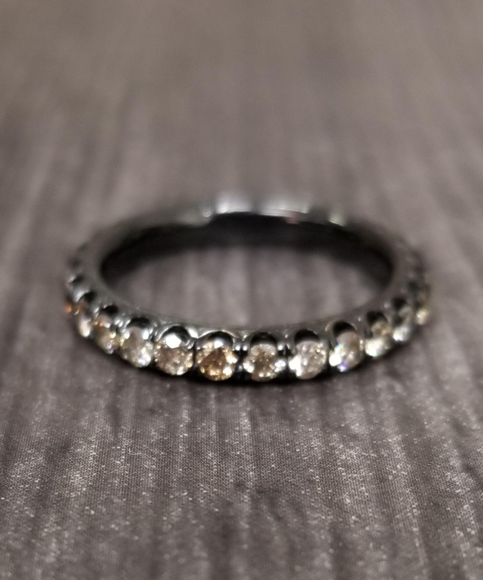 14k white gold  Black Rhodium diamond eternity ring, containing 28 round full cut diamonds; color 