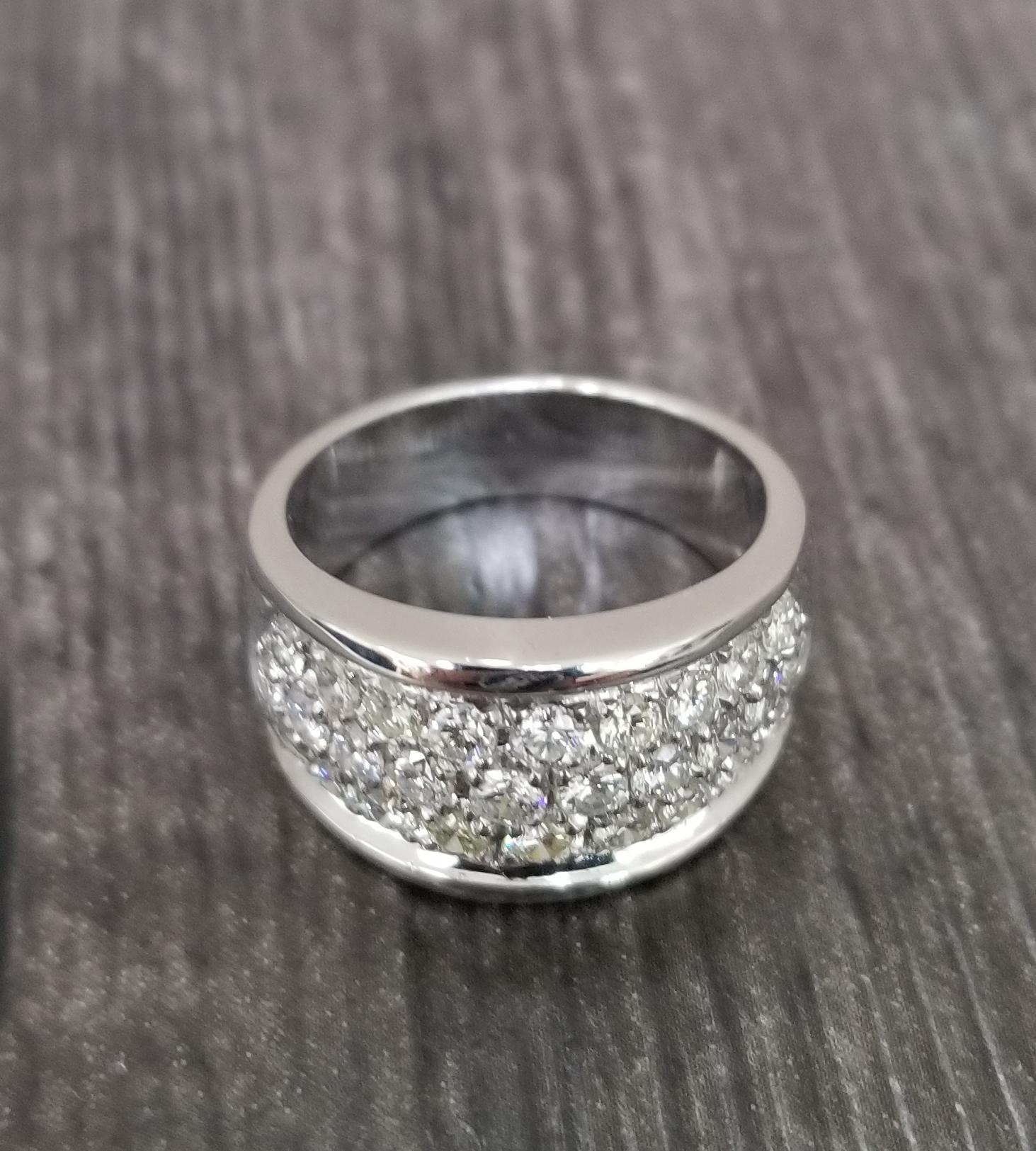 14k white gold pave diamond wedding ring, containing 28 round full cut diamonds; color 