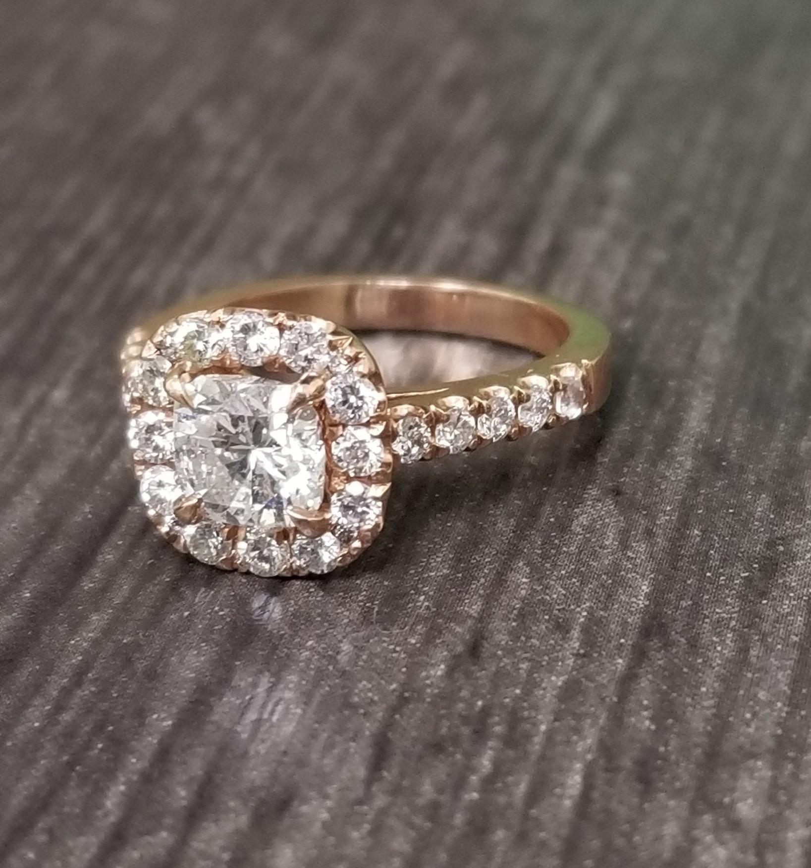 14k rose gold ladies diamond halo ring containing 1 radiant cut diamond; color 