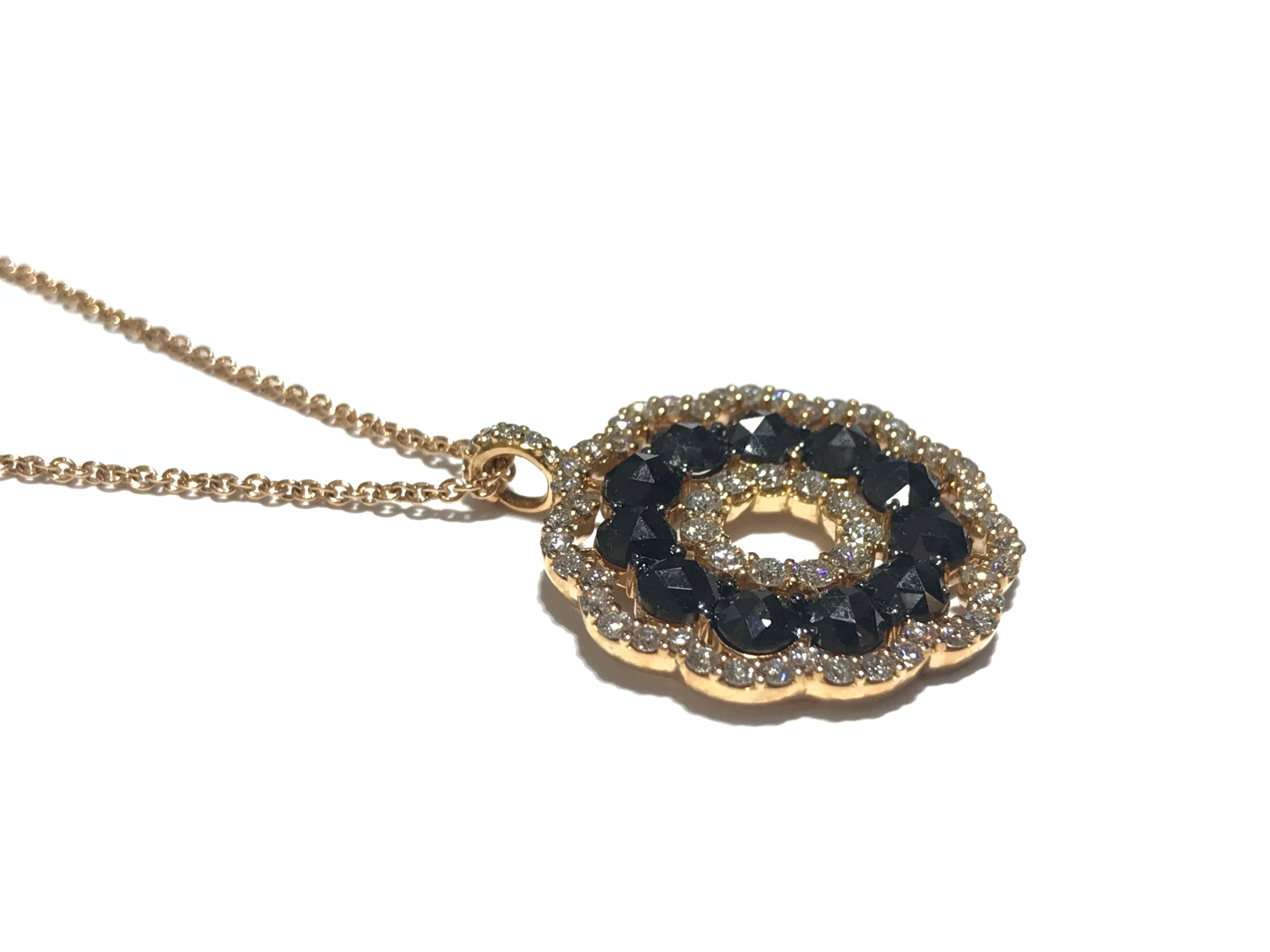 Crivelli Circle of Life pendant Necklace with black and white diamonds 
0.75 carat white diamonds VS clarity F colour
1.68 carat black diamonds 
16 inch chain in 18 karat rose gold 
