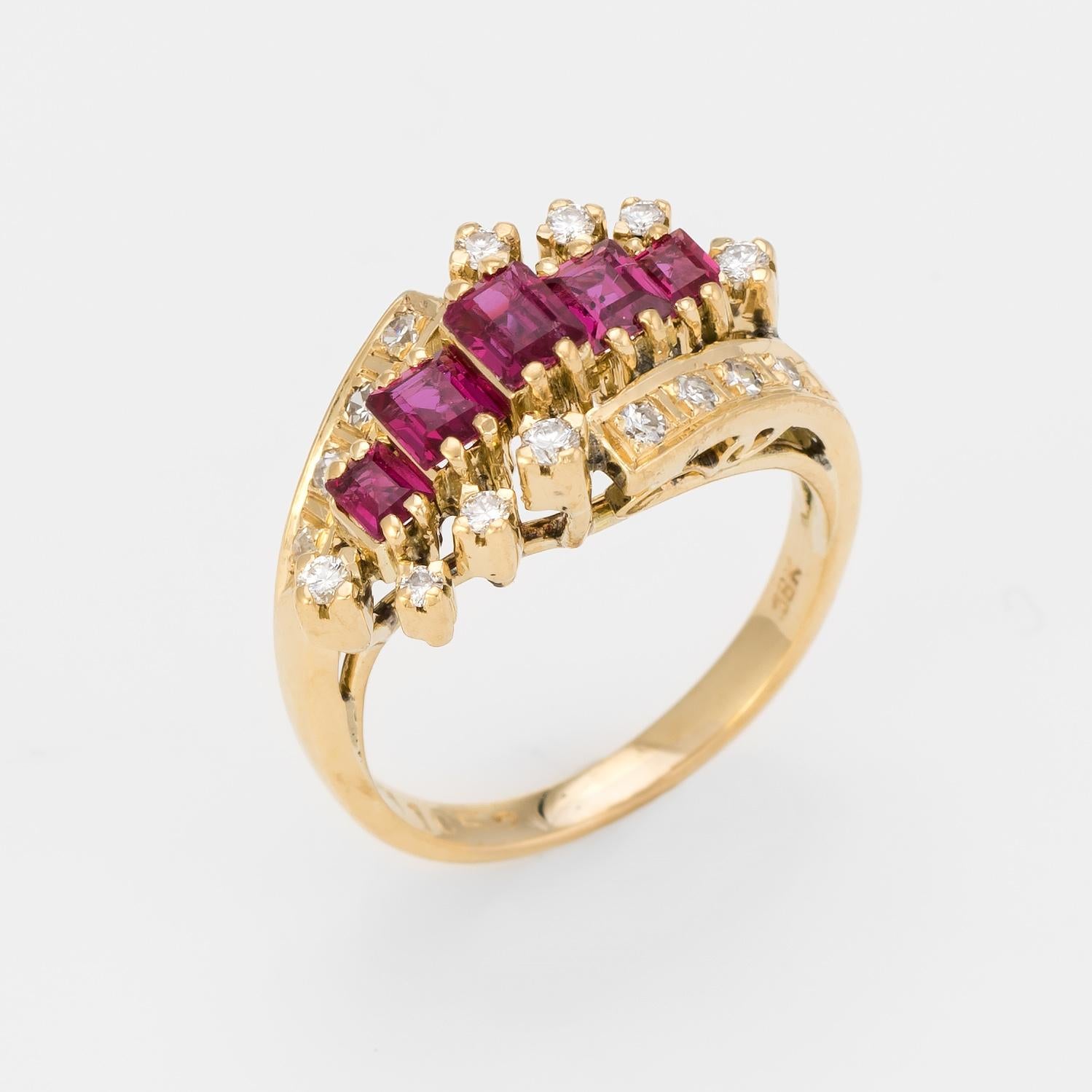 Finely detailed vintage ruby & diamond ring (circa 1960s to 1970s), crafted in 18 karat yellow gold. 

Emerald cut rubies graduated in size from 2.5mm to 4mm. The total ruby weight is estimated at 1 carat. 16 round brilliant and single cut diamonds