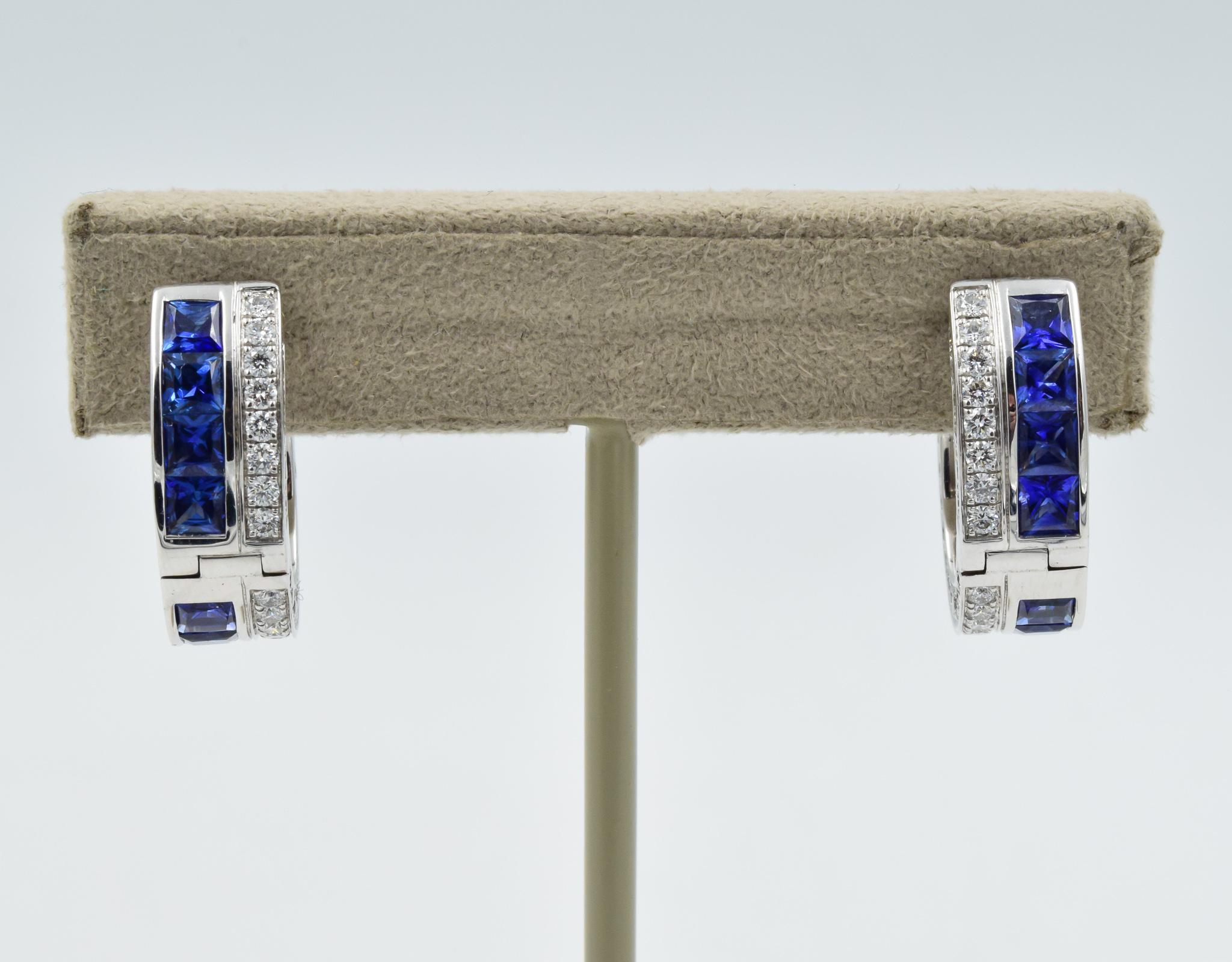 These earrings are absolutely stunning and gleam with fine quality blue sapphires and diamonds.  The square-cut blue sapphires are all hand-set in an invisible style setting which curves from the front to the back of the earring.  There are diamonds