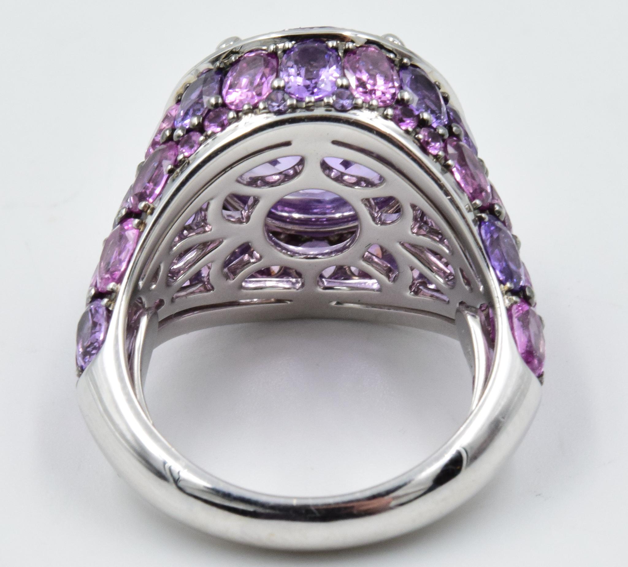 This American Glamour ring by Robert Procop is crafted with the highest quality in all stages of this design coming to life.  The gemstone is an incredible 7.12 carat Oval Purple Sapphire with a GIA certification.  The side sapphires and diamonds