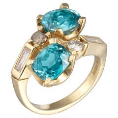 Anillo Cruzado Circón Azul - Oro amarillo 18 ct con diamantes