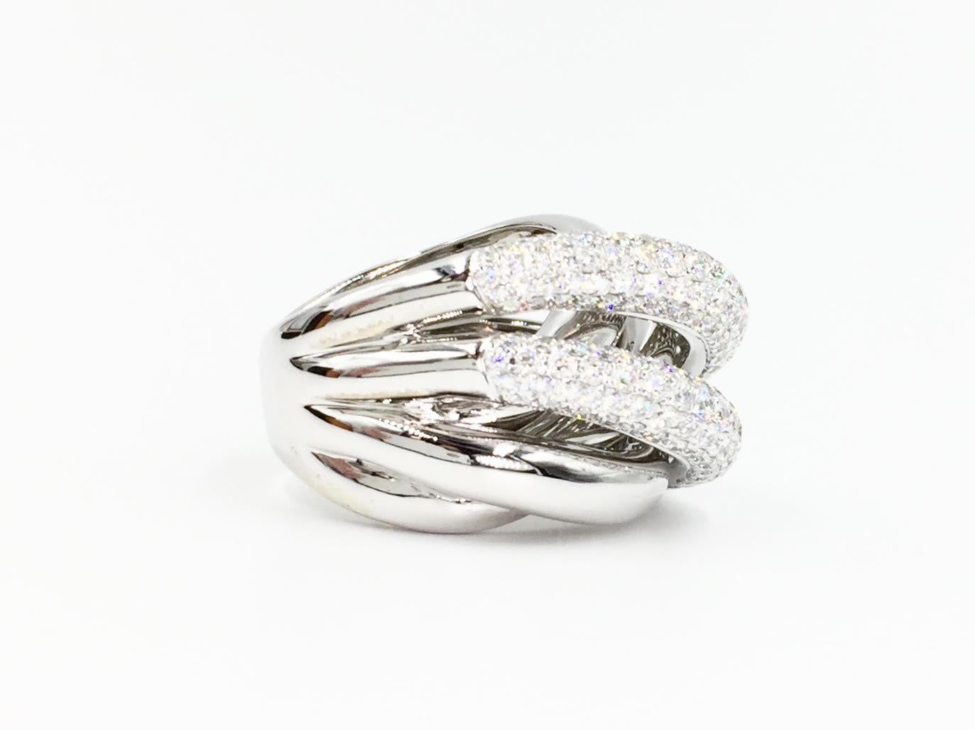 18 Karat white gold Bessa multi-row wide ring with a five row silhouette. Bright white pavé set diamonds with a total weight of 4.05 carats - approximately E-F color, VS2 clarity. Inside of ring signed BESSA along with the diamond total weight.