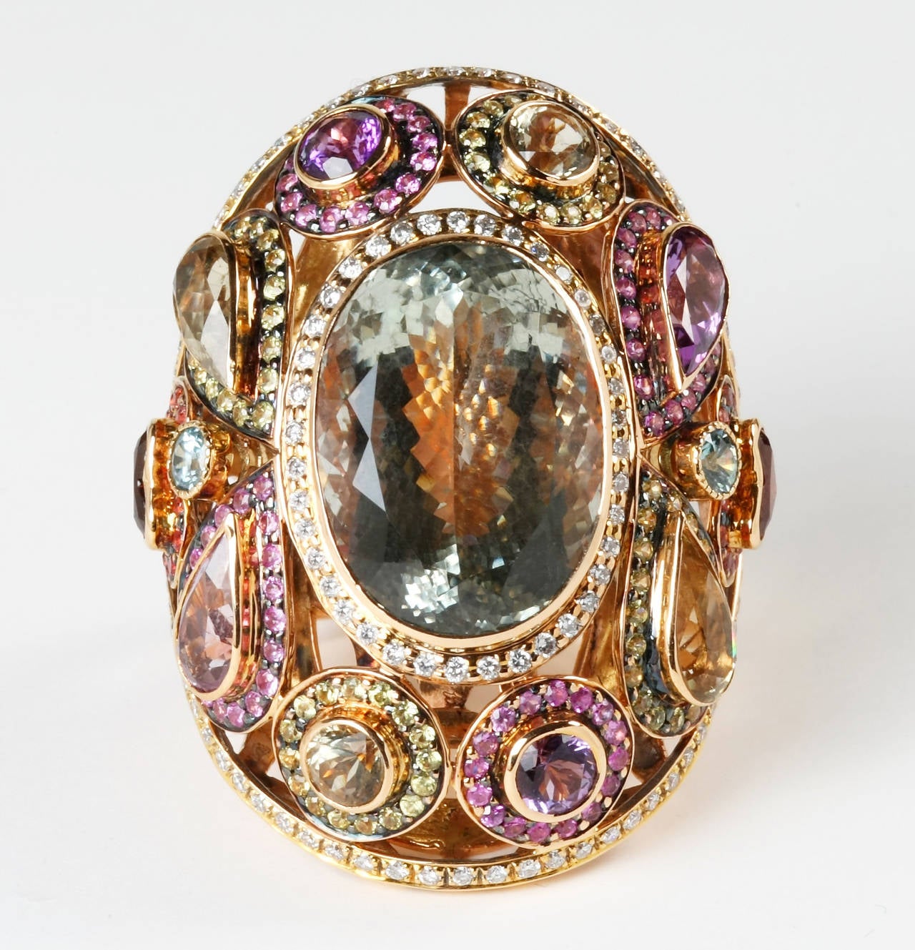 A bold 18K ring set to impress with vivid colors of sapphires, amethyst, peridot garnet and citrine gemstones.  Also surrounded with diamonds to complete the stylish piece. Ring fits a 7.25 finger size but can also be sized from 6.5 -