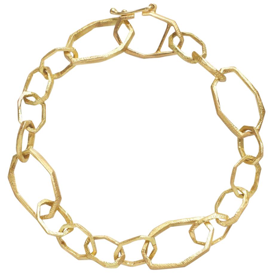 Handcarved 18KT gold bracelet.  Can be used as a charm bracelet or just a classic gold link necklace.  Piece measures 18