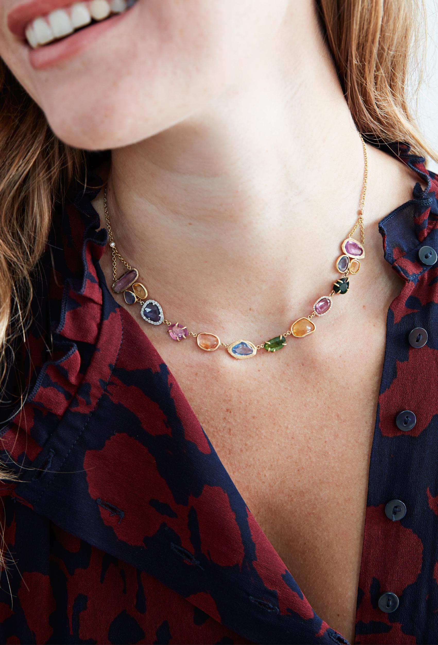 Handcarved 18KT Gold necklace with multi-colored sapphires including diamonds, tsavorite garnets, blue sapphires, orange sapphires, and pink sapphires.  One-of-a-kind necklace with over 20 total carats weight.  It is a stunning sapphire necklace