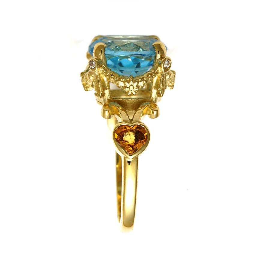 The Vibrant Embrace Ring is a one of a kind enchanter. 

Handcrafted in 9ct yellow gold the ring features a stunning, 12mm round aquamarine. The aquamarine is set in a signature William Llewellyn Griffiths garland setting, each of the four claws are