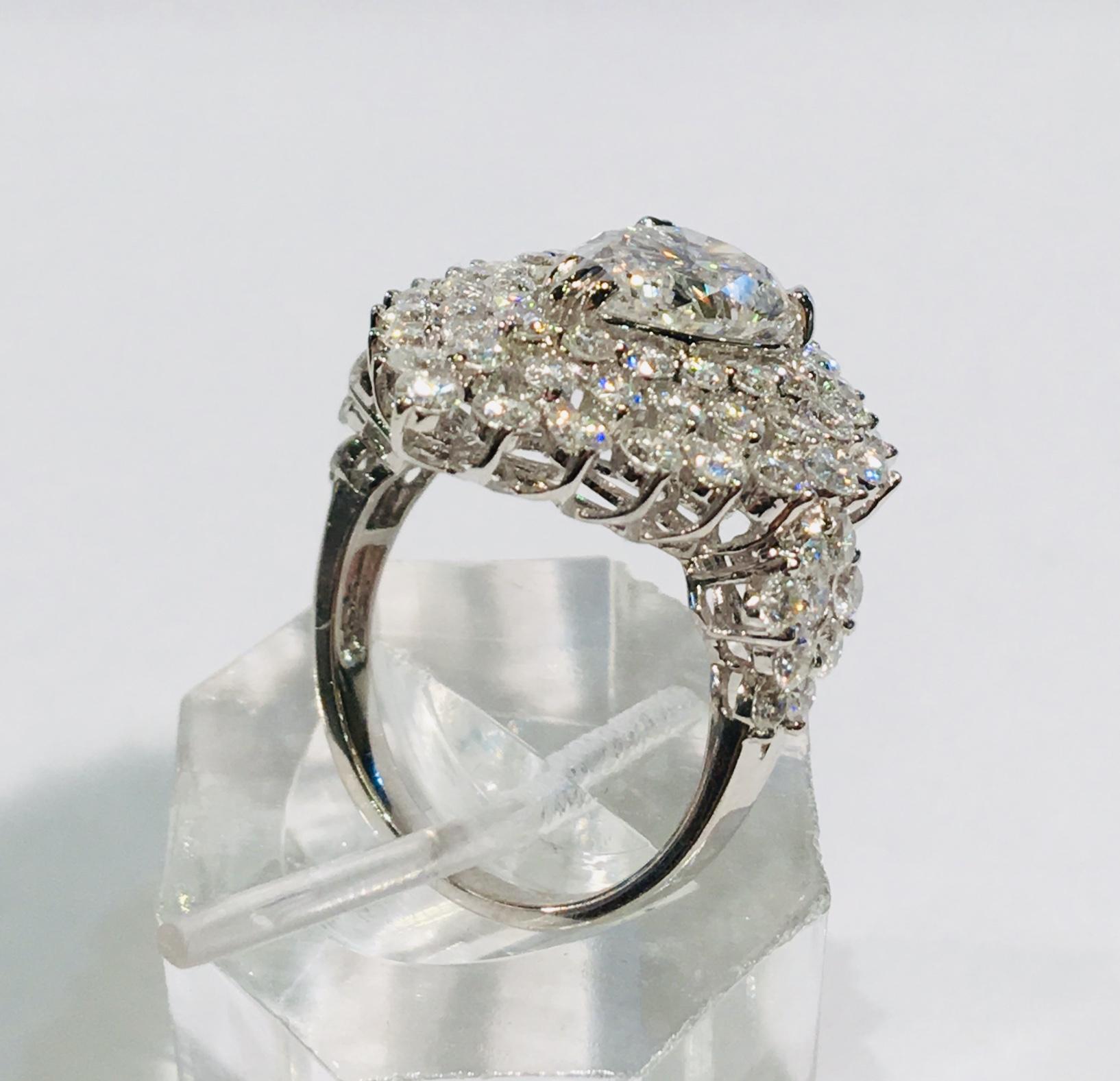 Dazzling 6.13 Carats F Color Diamond Ring with 2.63 Carat Pear Center 18 Karat 6