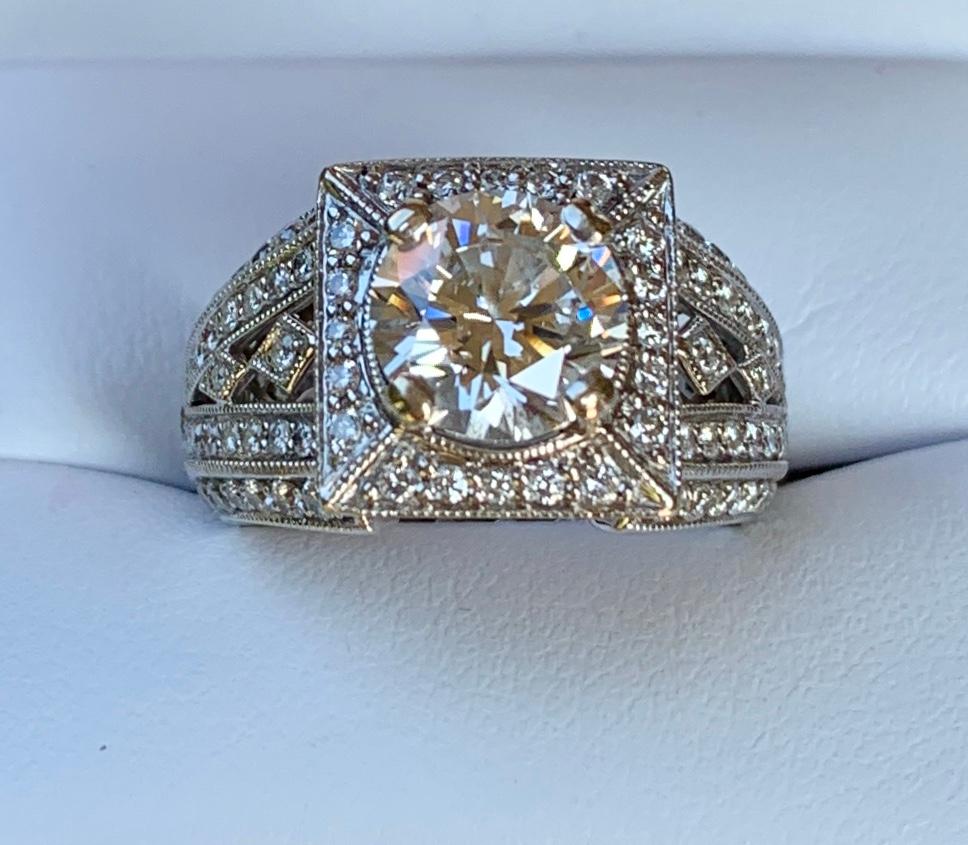 GIA Certified 1.85 Carat VVS2 - F Round Brilliant Diamond, 18 Karat White Gold, Eternity Style Engagement, Wedding or Bridal Ring.  GIA Report # 11795074.

Deco-inspired, estate diamond 18 karat white gold engagement ring features a prong-set, GIA