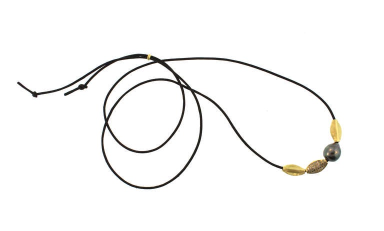 Pearl and Gold Beads on Leather