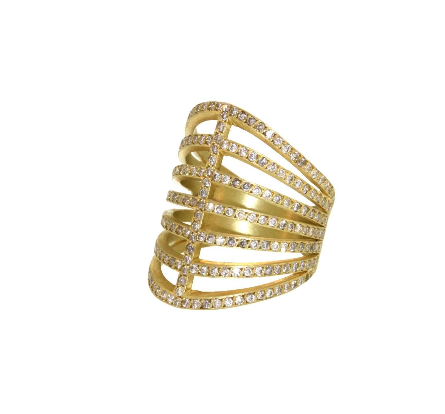 Both feminine and structured, this corset-like, sparkly pavé diamond ring wraps around the finger delicately. This piece is composed of seven static 2mm wide, brilliant pavé diamond bands. It measures 25mm in length, and tapers to 5mm in the back,