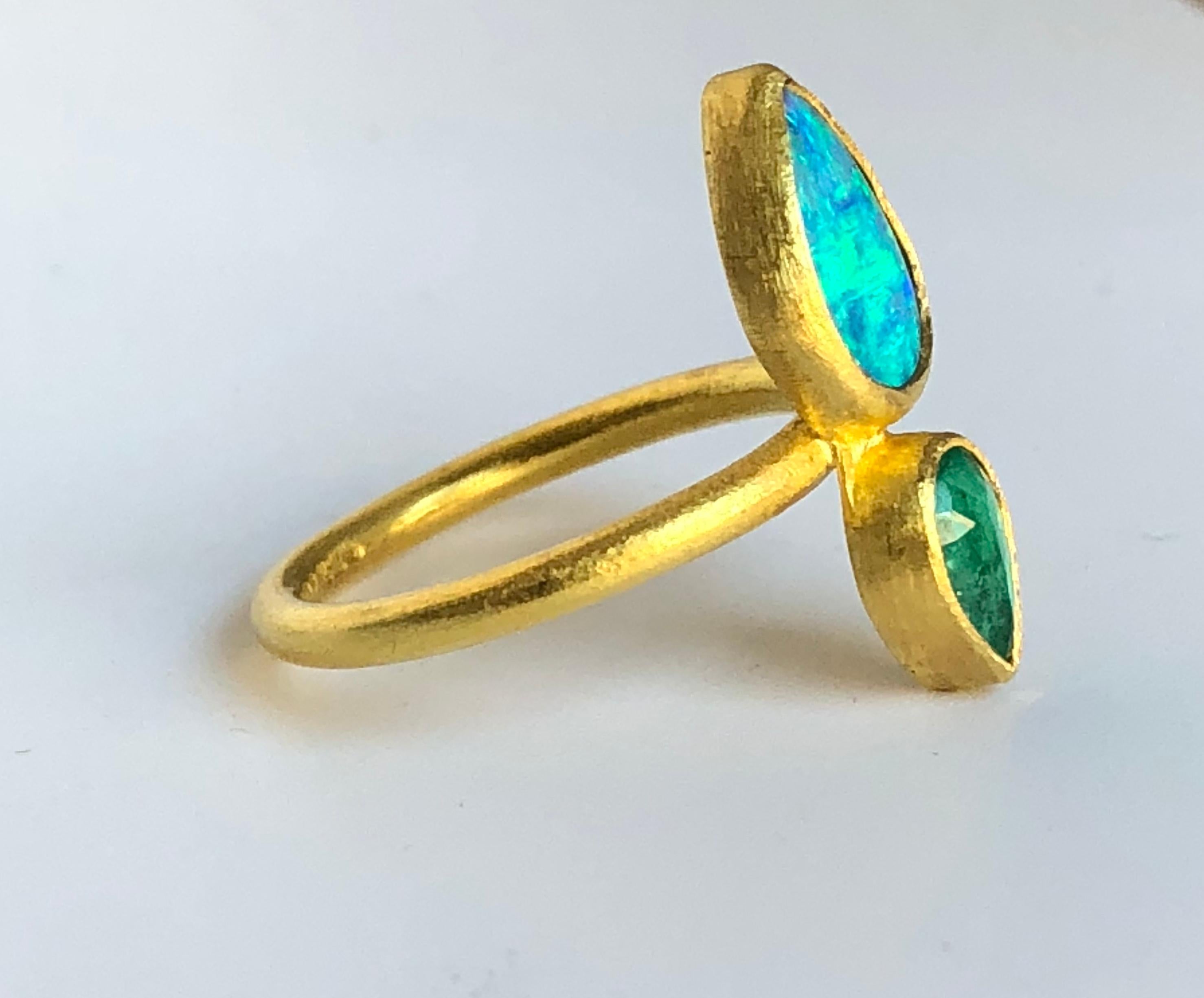 Handcrafted double stone ring by Stephanie Albertson featuring a .45 ct rose cut Zambian emerald and a brilliant blue Australian crystal opal in 22k gold. Size 7. Can be sized. 