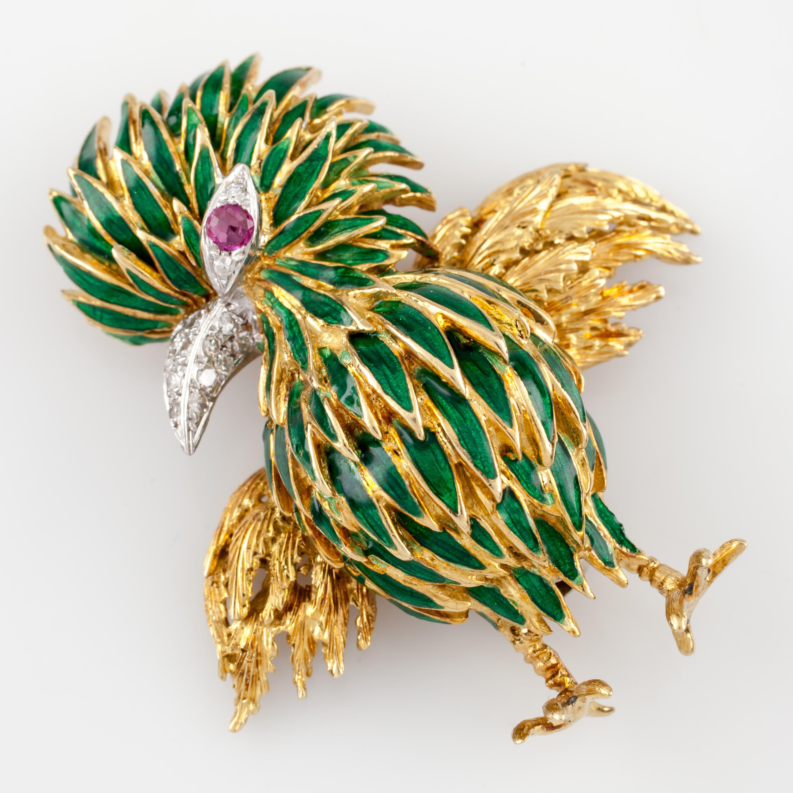 Beautiful vintage 18k yellow gold bird with green enamel feathers
Featuring diamonds on the beak and a ruby eye
Size: 1 3/4