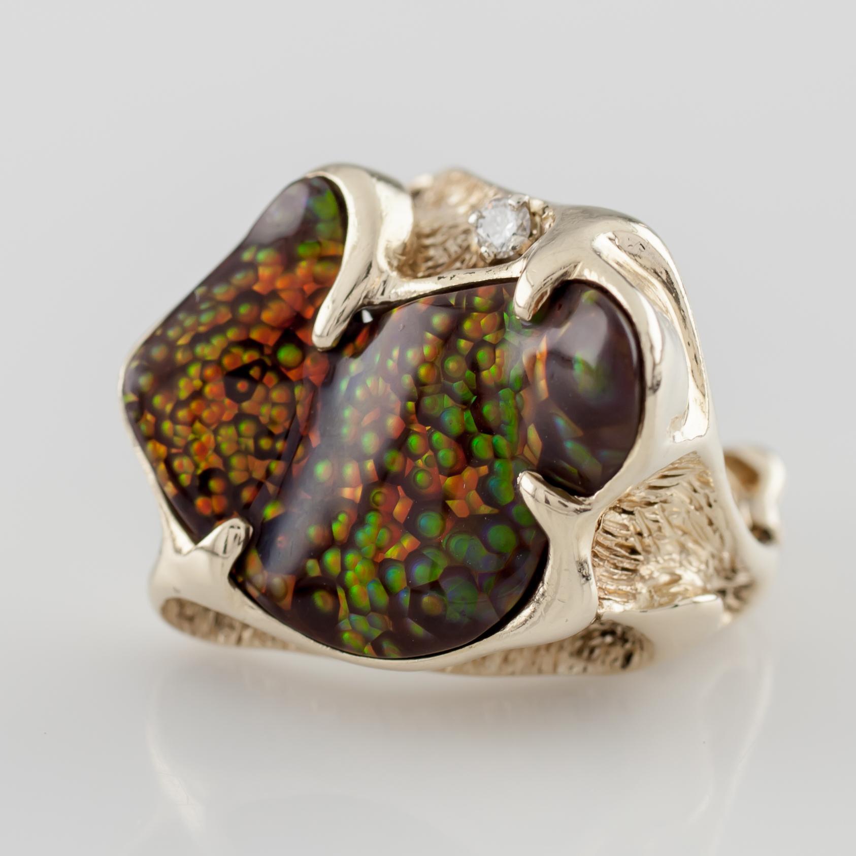 Gorgeous Custom-Molded Fire Agate Ring 
Ring Includes Diamond Accent
Approximate Width of Agate on Ring = 24 mm
Approximate Length of Agate on Ring = 21 mm
Mass of Ring = 18.4 grams