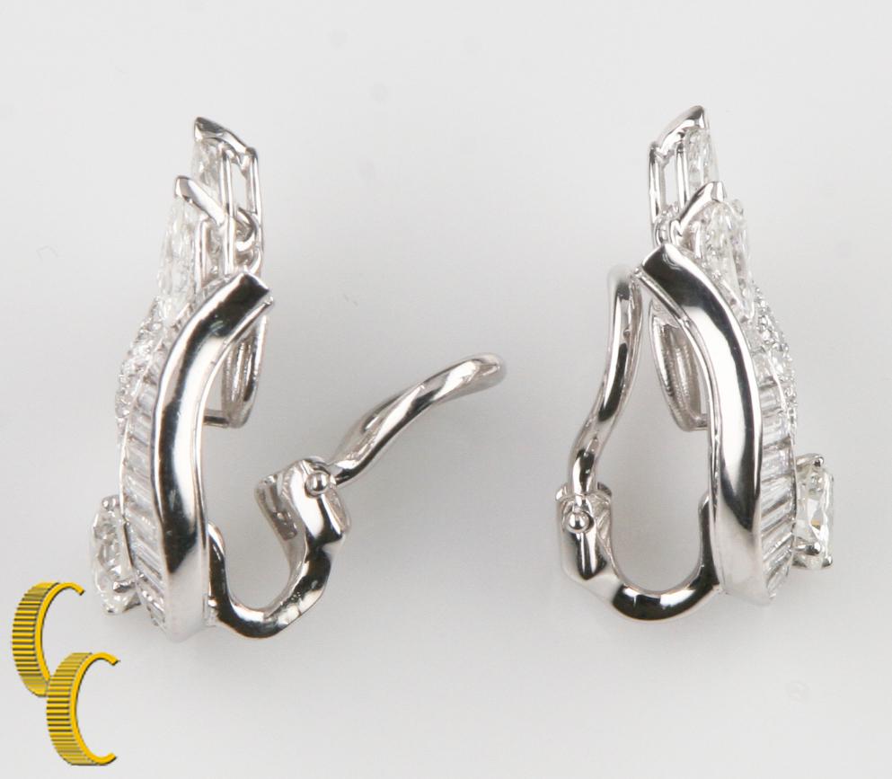 Gorgeous 14k White Gold Earrings in an Abstract Floral Design
Feature Channel-Set Baguette Cut Diamonds, Pavé-Set Round Cut Diamonds, Prong-Set Marquise Cut Diamonds, and a Prong-Set Round Brilliant Solitaire
Amazingly Eye-catching!
TDW =