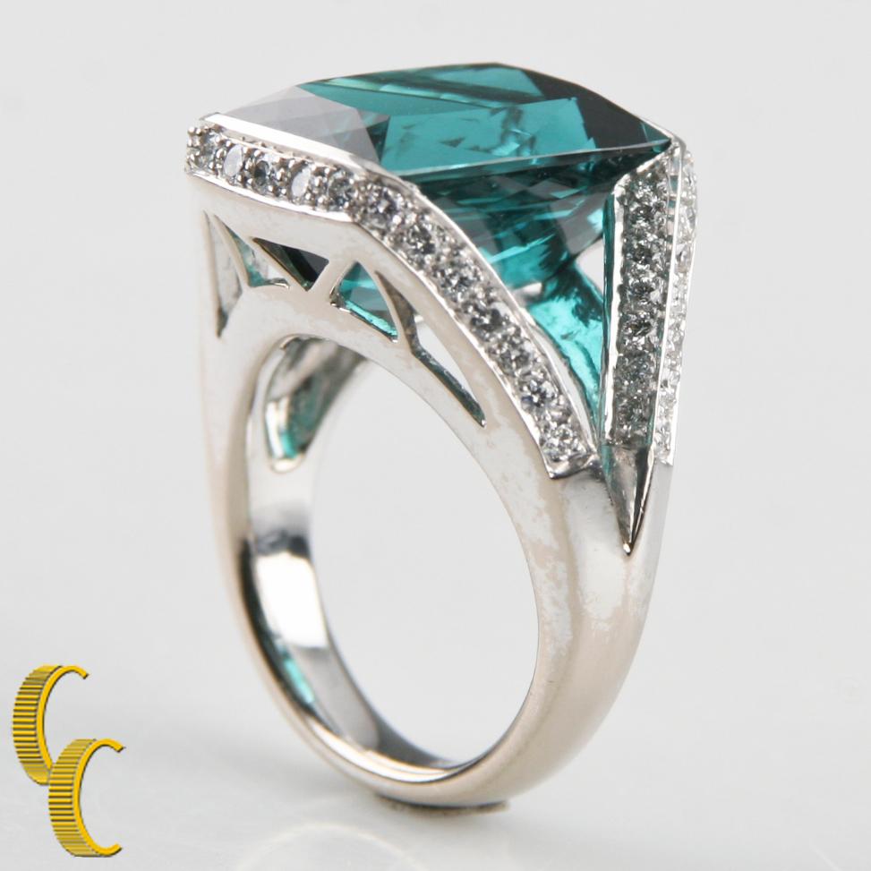One electronically tested 18KT white gold ladies cast indicolite tourmaline & diamond ring with a bright finish
Condition is good.
Ladies 18KT White Gold Indicolite Tourmaline & Diamond Ring
Ring size = 5 1/2
The ring features an indicolite