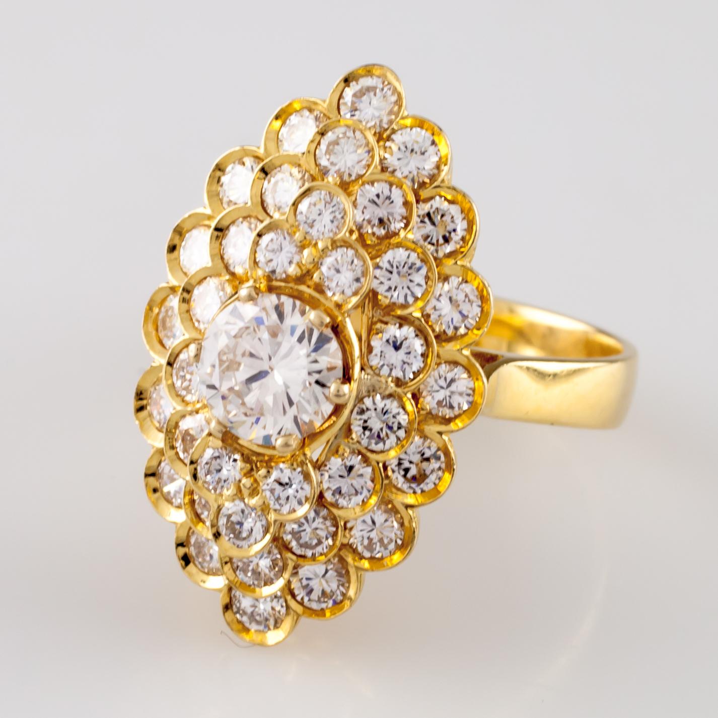 Gorgeous 18k Yellow Gold Diamond Cluster Ring
Features Channel-Set Accent Stones in a Terraced Gallery Surrounding .82 ct Center Stone
Carat Weight of Accent Stones = Appx. 1.90 cts
Average Color = D
Average Clarity = VS
GIA-Certified Center Stone.