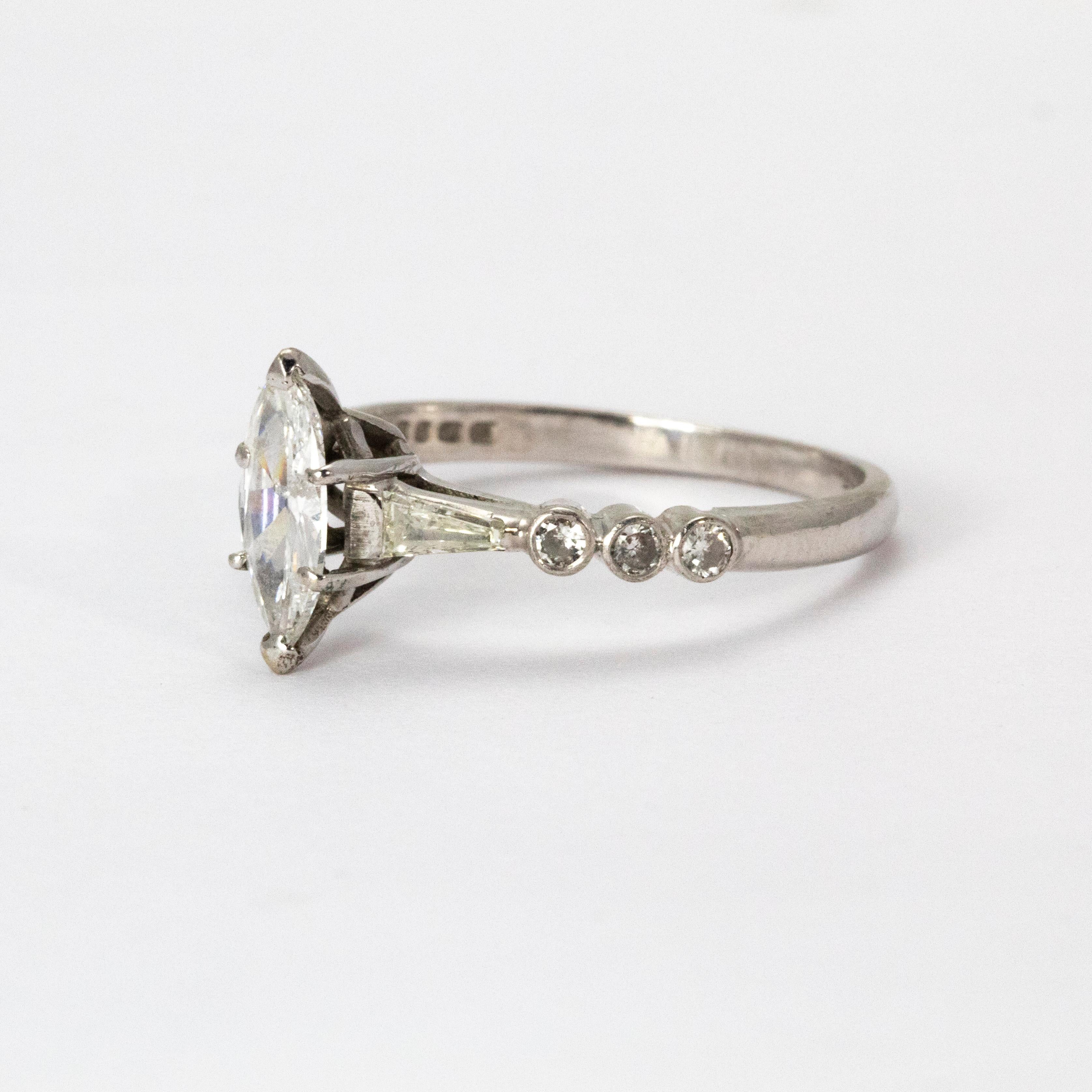 This stunning diamond marquise ring was crafted circa 1940. The brilliant central marquise cut diamond weighs 1.05 carats and is elegantly flanked by tapering baguette diamonds. Modelled in 18 karat white gold.

Ring Size: T or 9.5