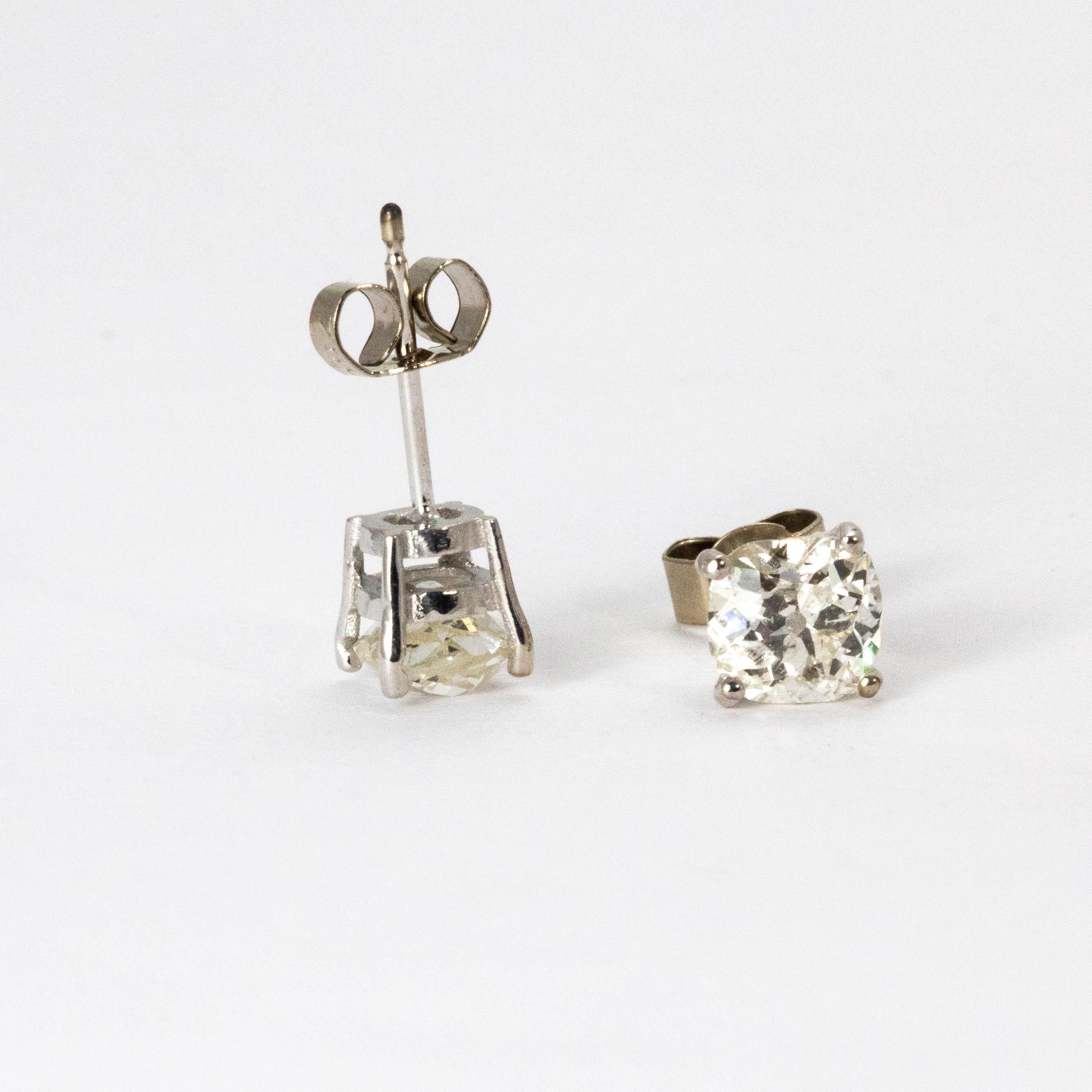 A classic pair of Art Deco diamond stud earrings. The earrings are set with a stunning white old European cut diamond weighing 95 points each, G colour and VS2 clarity. The stones are in a four claw setting and modelled throughout in 18 karat white