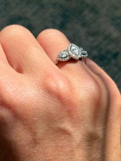 Modern Platinum Marquise and Pear Shape Diamond Three Stone Ring