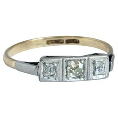Art Deco Diamond Platinum and 18 Carat Gold Panel Three Stone Ring