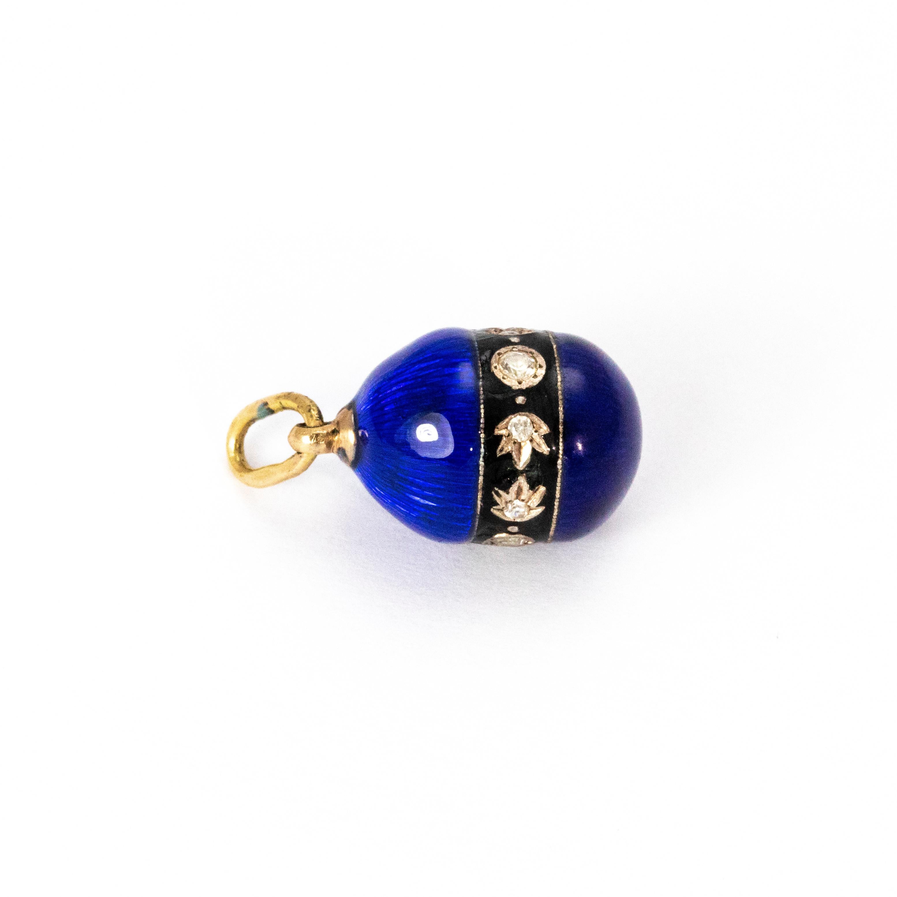 A beautiful Victorian royal blue enamel egg set with a 14 karat yellow gold loop, likely crafted in continental Europe.

Length: 20mm