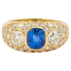 Vintage-Ring aus den 1980er Jahren mit einem unbehandelten Saphir und einem Diamanten, 18 Karat Gelbgold, gewölbte Form, GIA