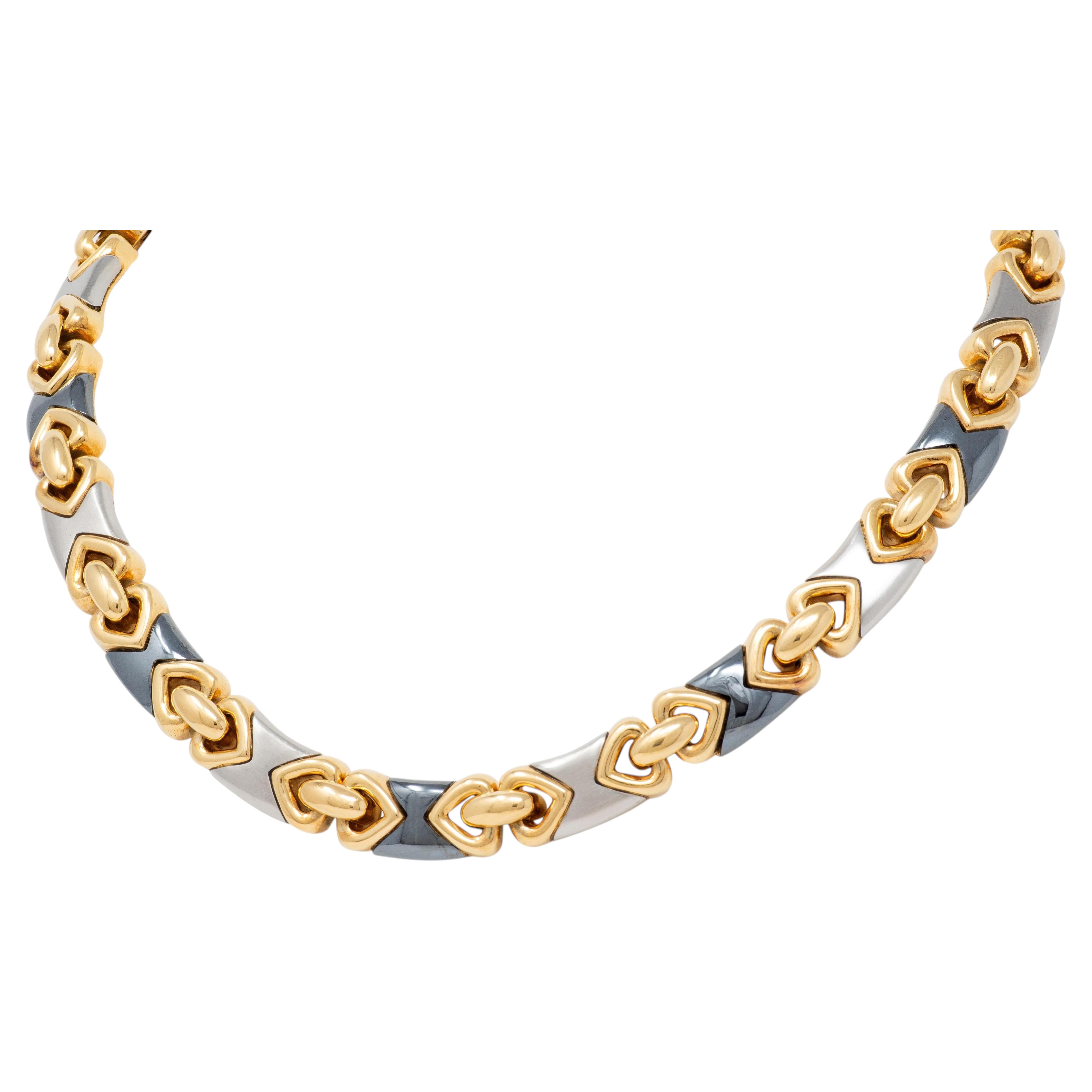 Collar vintage «Doppio Cuore» de Bulgari de los años 80, en oro amarillo de 18 quilates, hematita y acero