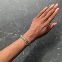 Bulgari Armreif im Vintage-Stil aus 18-karätigem Gelbgold und Edelstahl mit Spiga-Chevron-Motiv