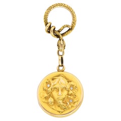 Shreve & Co. Médaillon ancien Art Nouveau en or jaune 14 carats avec femme serpentine en diamants