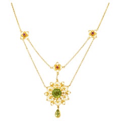 Victorian Peridot Ruby 14 Karat Yellow Gold Antique Starburst Swagged Necklace