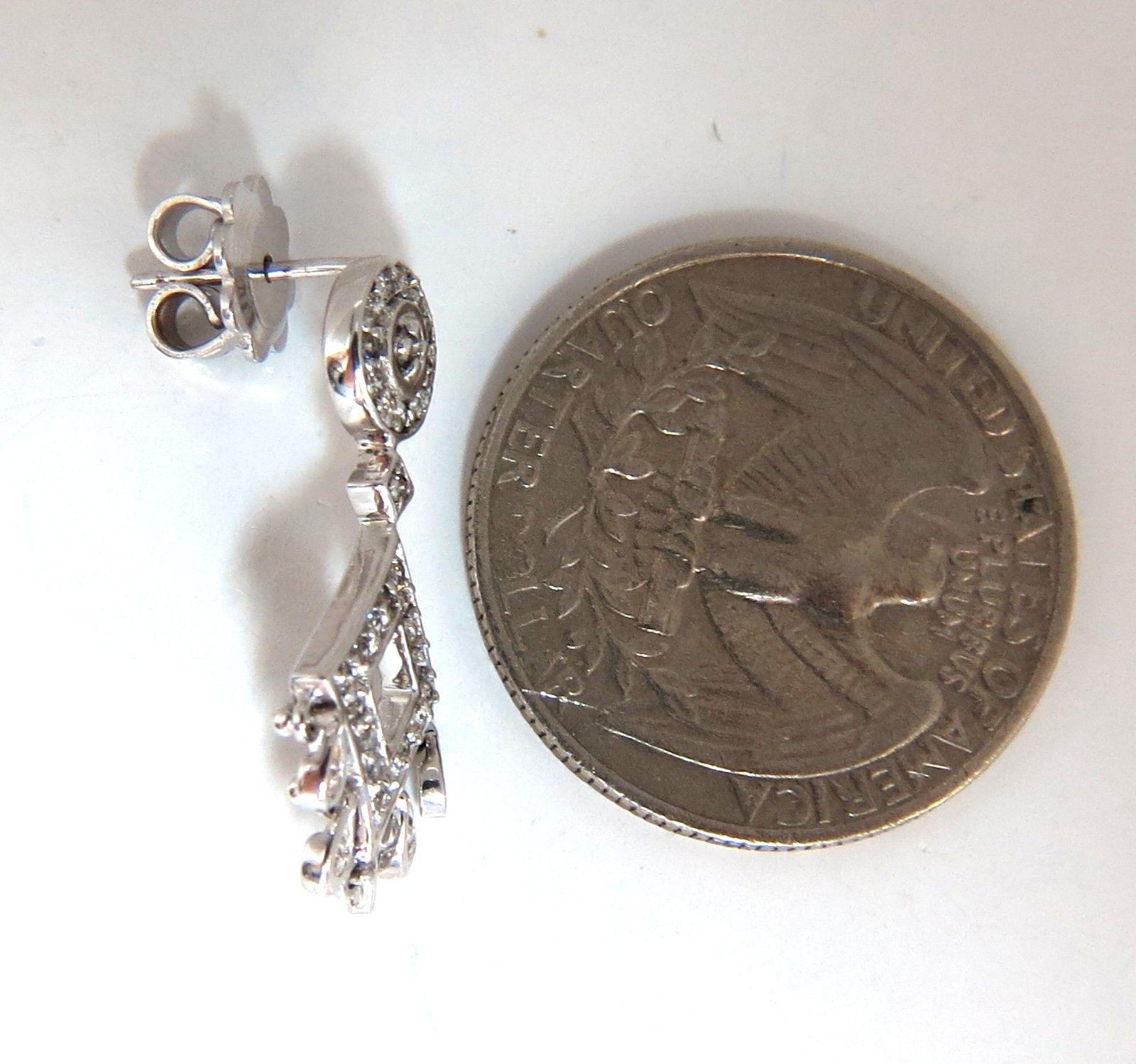 Petite Chandelier Dangle 

.50ct. Round, Full cut diamonds dangle earrings.

 H color, Vs-2 clarity.

Overall:

1 Inch long

Butterfly push backs

4.3 grams.

14kt white gold