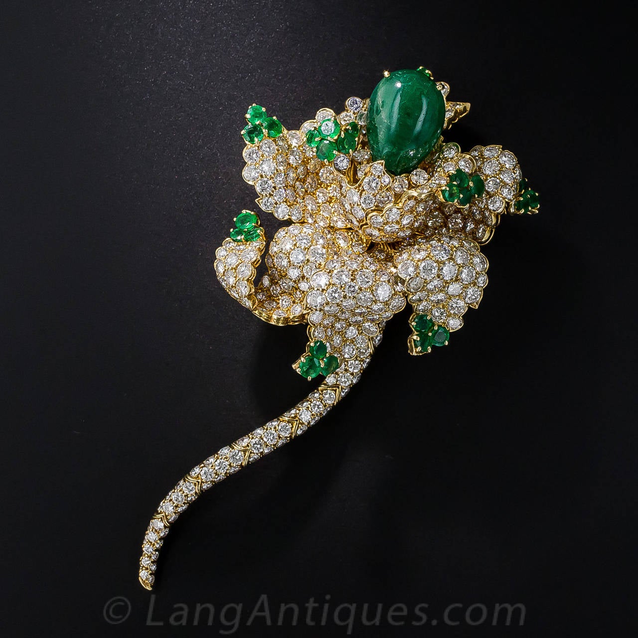 Although mysteriously unsigned, this breathtaking work of jewelry art rates among the finest latter-twentieth century pieces ever conceived or rendered by the most eminent French or American jewelery houses. The sculptural flower brooch is composed