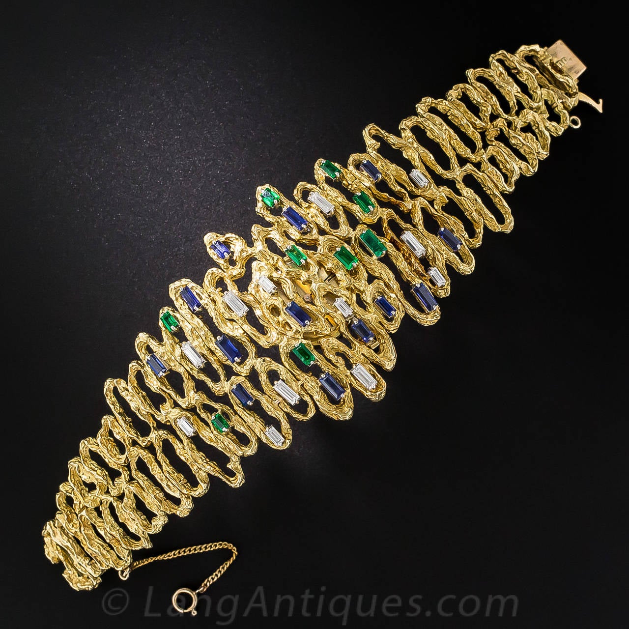 We're just crazy about over-the-top sixties jewelry, especially when its as wild and wonderful as this showstopping (and sizable) stunner. This abstract work of wearable art is rendered in richly textured 18K yellow gold and glistens and sparkles