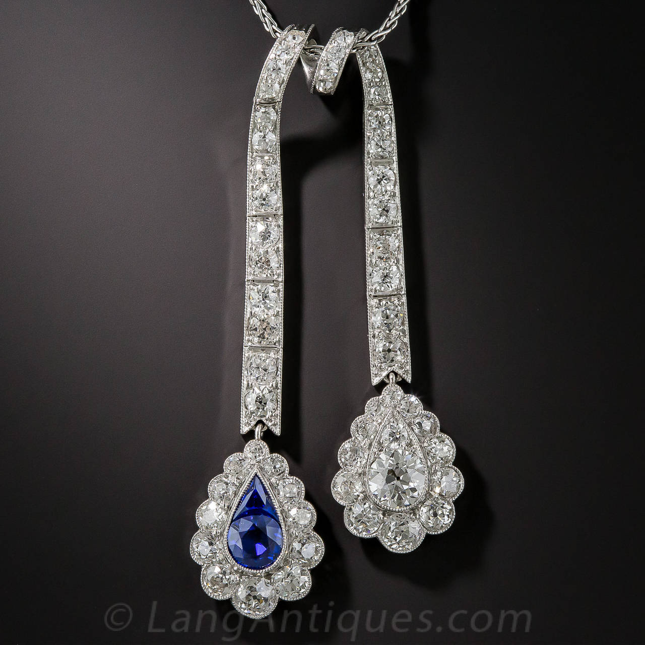 In the jewelry world, lavalier necklaces with asymmetrical drops such as this are referred to as negligees (not to be confused with the slinky sheer nightgowns), and this sparkling early-twentieth century jewel, in glorious blue & white, is as