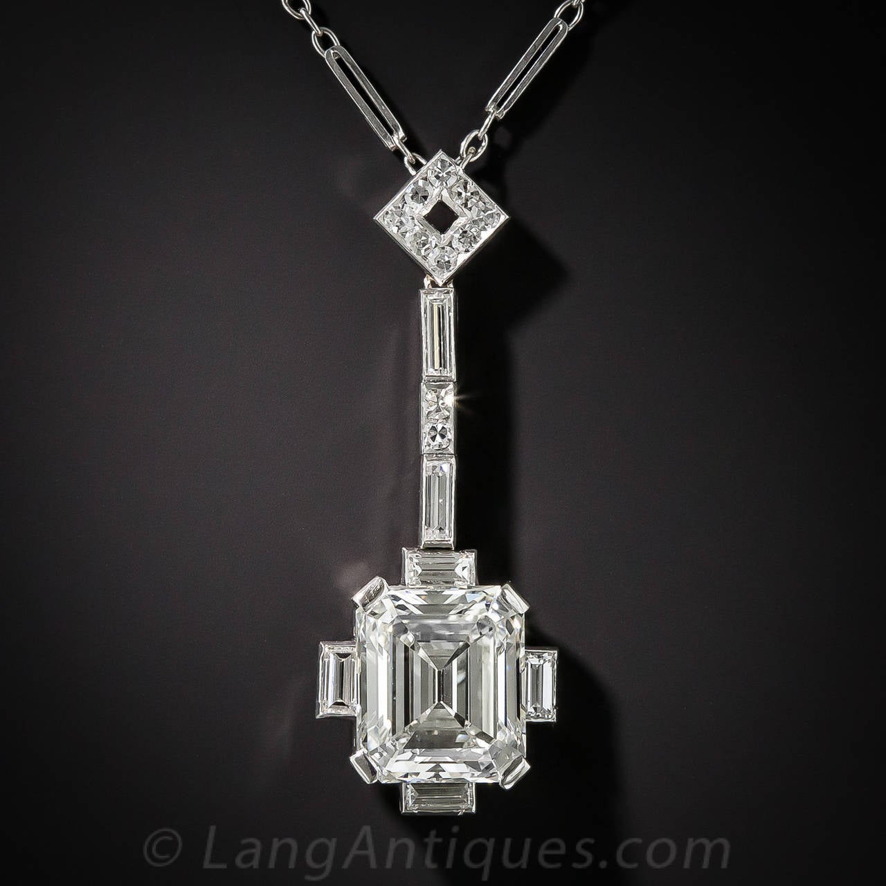 Rare, radiant and ravishing. A classically fashioned, vintage emerald-cut diamond (a.k.a. Asscher-cut), weighing 3.47 carats (accompanied by a GIA Diamond Grading Report stating: J color - VS1 clarity) is elegantly presented in timeless Art Deco