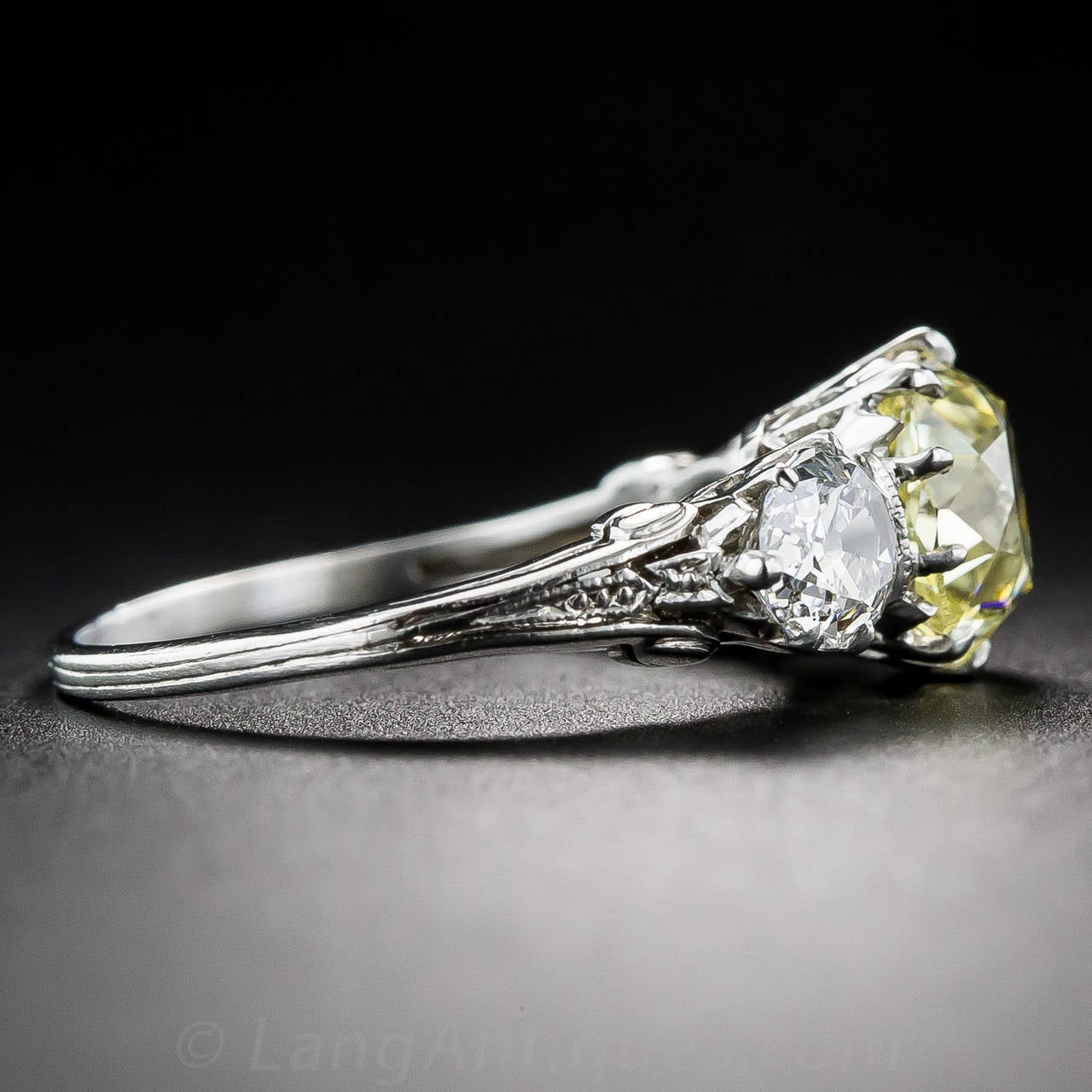 Women's Edwardian 1.81 Carat Fancy Intense Yellow Diamond Platinum Three Stone Ring